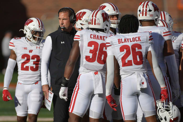 Oct 21, 2023; Champaign, Illinois, USA; Wisconsin Badgers head coach Luke Fickell with his players during the first half against the Illinois Fighting Illini at Memorial Stadium. Mandatory Credit: Ron Johnson-USA TODAY Sports